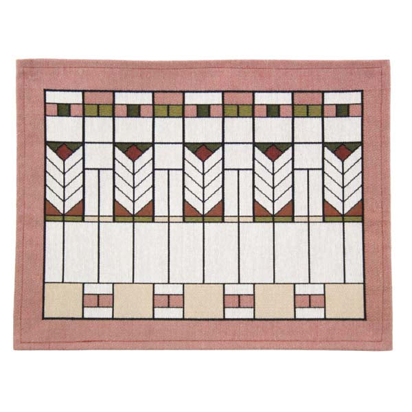 A rectangular placemat with a geometric pattern consisting of chevron stripes in a Prairie style design, featuring a poly/cotton blend fabric in muted colors.