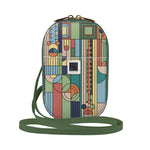 Colorful patterned crossbody bag with a green strap on a white background