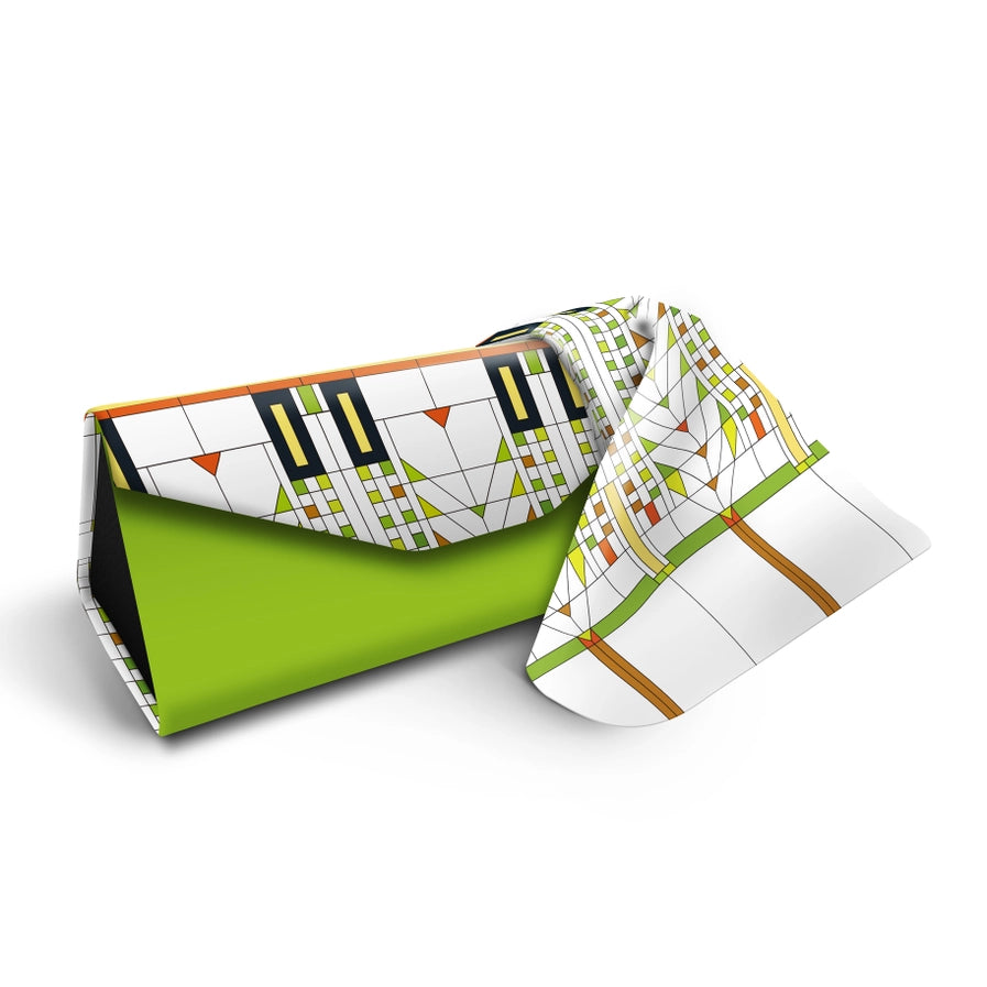 Green clutch with geometric patterned cover on a white background