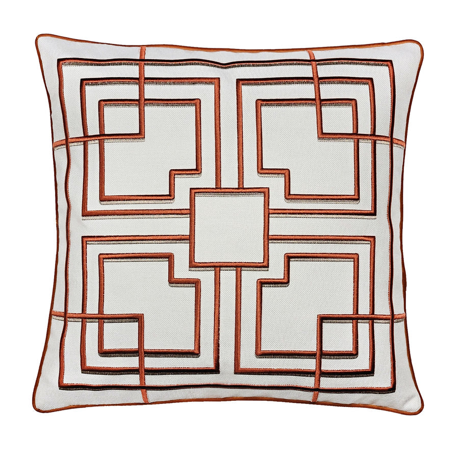 A square throw pillow with a geometric pattern featuring a central square with additional square outlines in a rust color on a white background, with a solid rust-colored border.