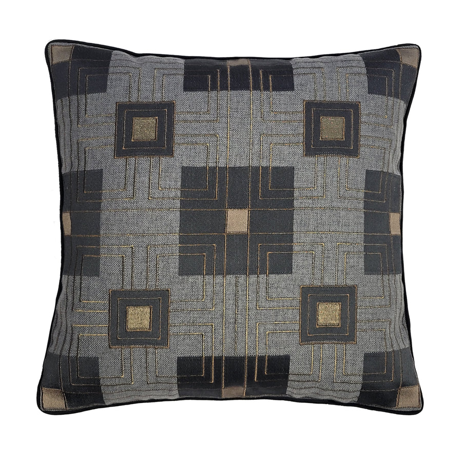 A square-shaped throw pillow with a geometric pattern in dark grey and gold colors, featuring embroidered details.