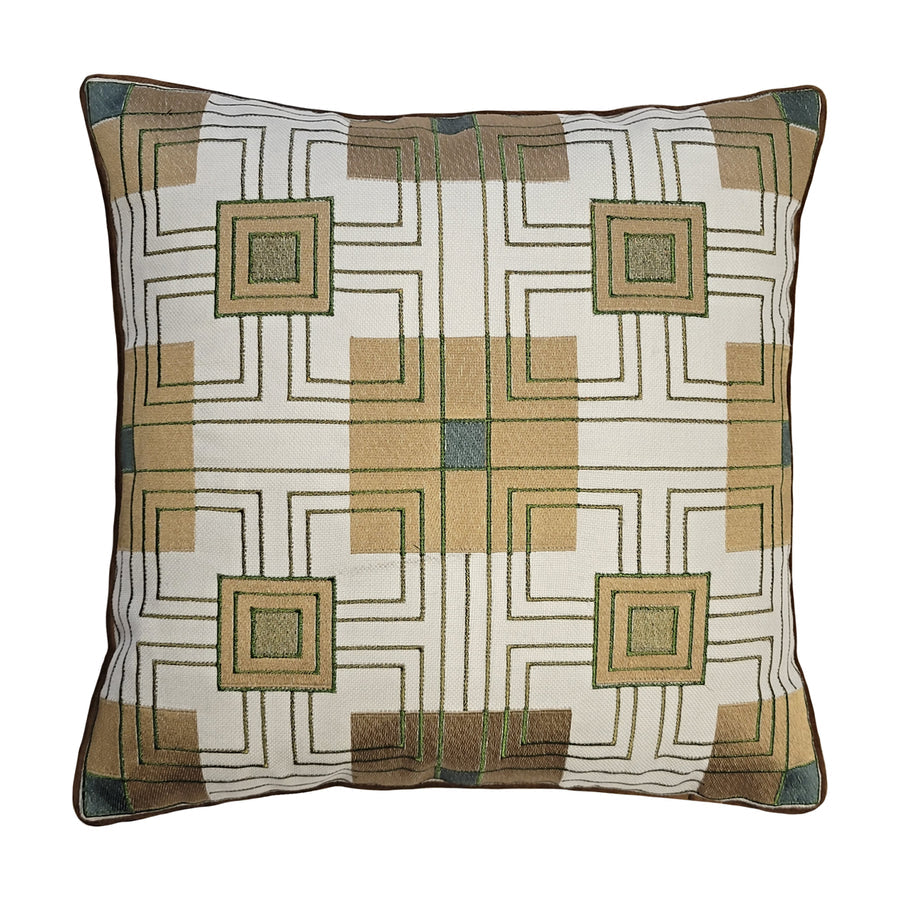 A square-shaped decorative pillow with a geometric pattern in beige, olive, and teal colors, featuring a design inspired by Frank Lloyd Wright's Storer House block embroidery.