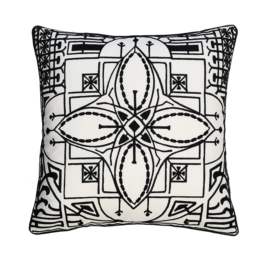 A square-shaped outdoor pillow with a geometric pattern featuring black and white colors and embroidered details.