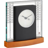 Decorative clock with a black face and wooden base on a white background