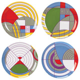 A set of four ceramic dessert plates, each with a geometric rug design in different colors.