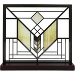Decorative stained glass panel with geometric design on a black frame