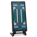 Decorative ceramic tile with geometric pattern on a stand against a white background