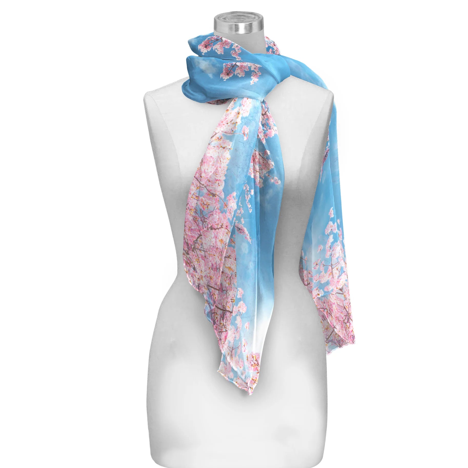 A silky sheer scarf with a cherry blossom design, displayed on a mannequin.