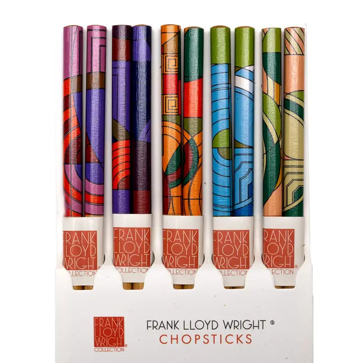 Set of Frank Lloyd Wright chopsticks with colorful packaging on a white background