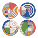 Four circular coasters with geometric patterns on a white background