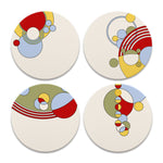 Four round coasters with abstract circular designs in red, yellow, blue, and green on a white background.
