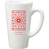 A white ceramic coffee mug with a geometric red design and text 'The Rookery Chicago, Illinois' on the front.