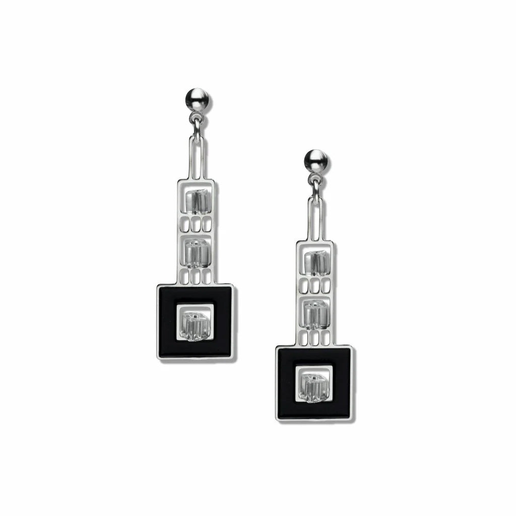 A pair of silver-colored earrings with black enamel and crystal bead details, designed in a geometric art deco style.