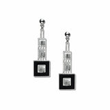 A pair of silver-colored earrings with black enamel and crystal bead details, designed in a geometric art deco style.