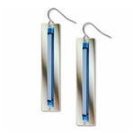 Silver earrings with blue rectangular stones on a white background