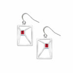 Silver earrings with red gemstones on a white background