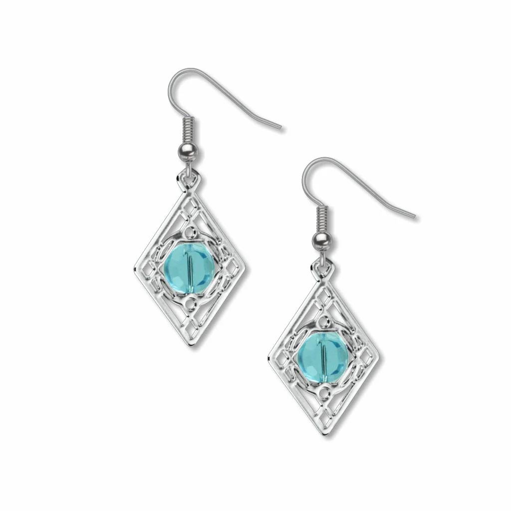 Silver earrings with turquoise gemstones on a white background