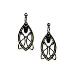 A pair of silver-colored, intricate patterned earrings hanging downwards, featuring green and black details within the design.