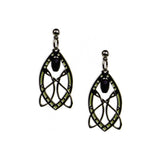 A pair of silver-colored, intricate patterned earrings hanging downwards, featuring green and black details within the design.