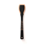 A black wooden serving paddle with a decorative gold pattern on the handle.