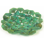 A round solid brass decorative plate with a patina finish featuring a ginkgo leaf design.
