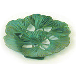 A decorative brass plate with a patina finish featuring a ginkgo leaf design, approximately 4.25 inches round.