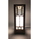 A mini lightbox lamp with a geometric Tree of Life design illuminated from within, set on a dark background.