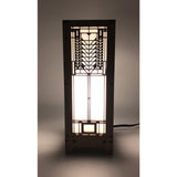 A mini lightbox lamp with a geometric Tree of Life design illuminated from within, set on a dark background.