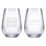 Two clear glasses with engraved text on a white background