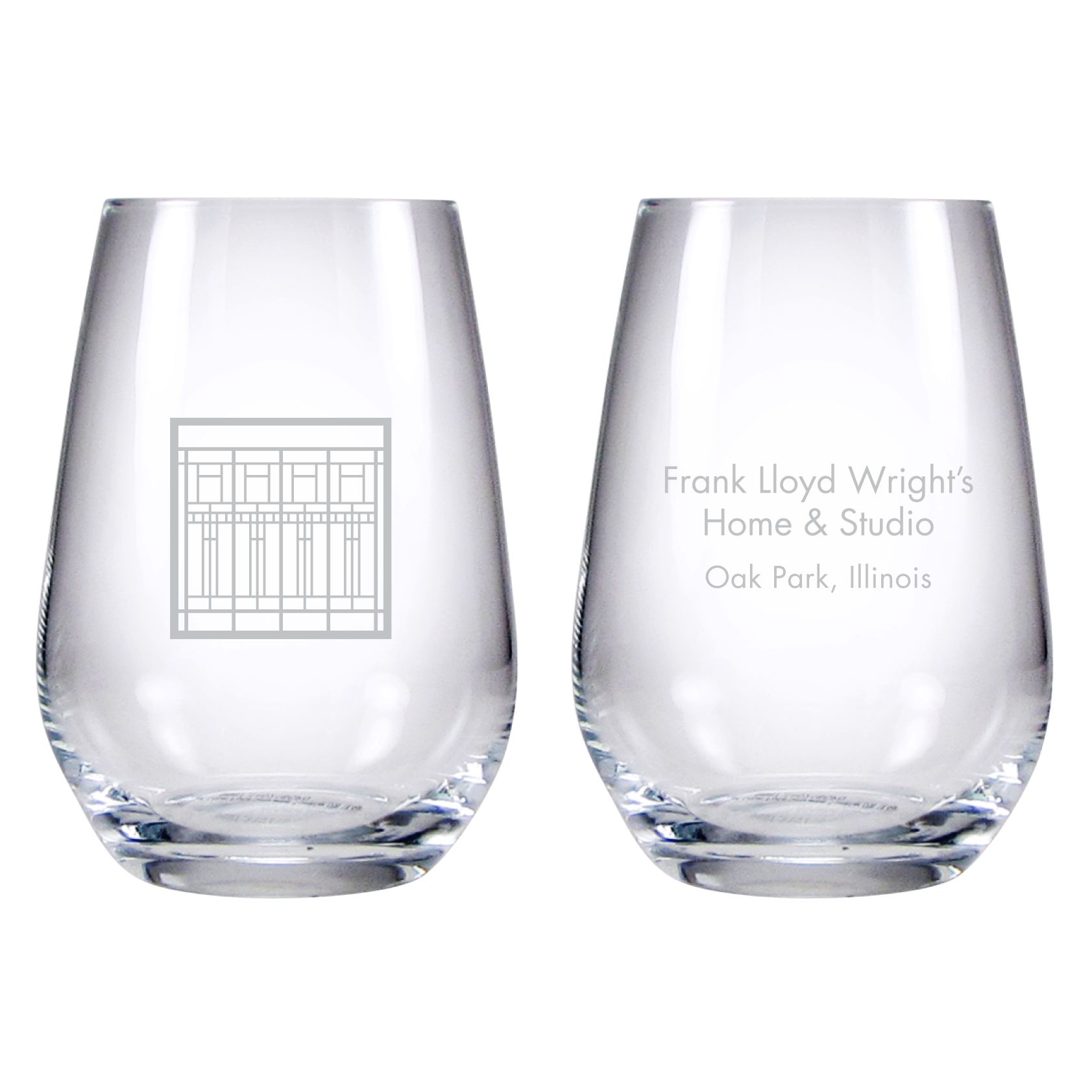 Two clear glasses with engraved text on a white background