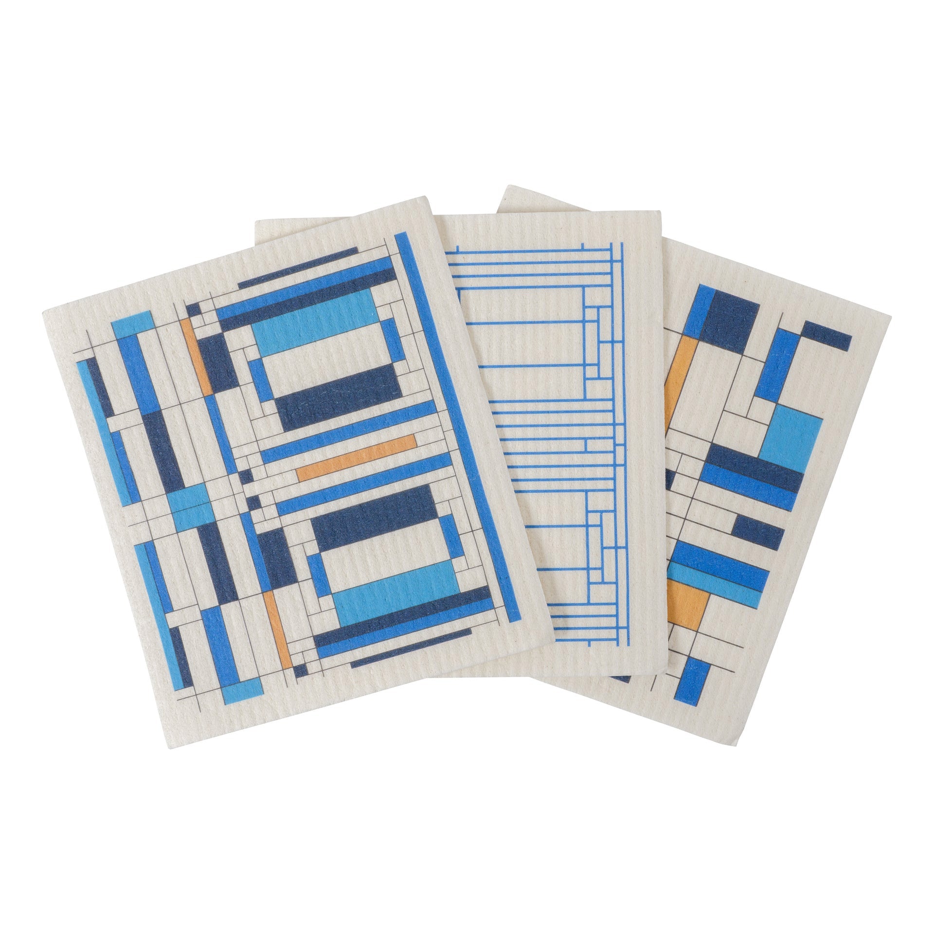 Three white dish cloths with blue geometric patterns, displayed splayed out on a surface.