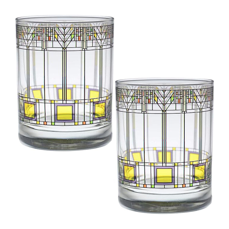 Two glass tumblers with geometric pattern on a white background