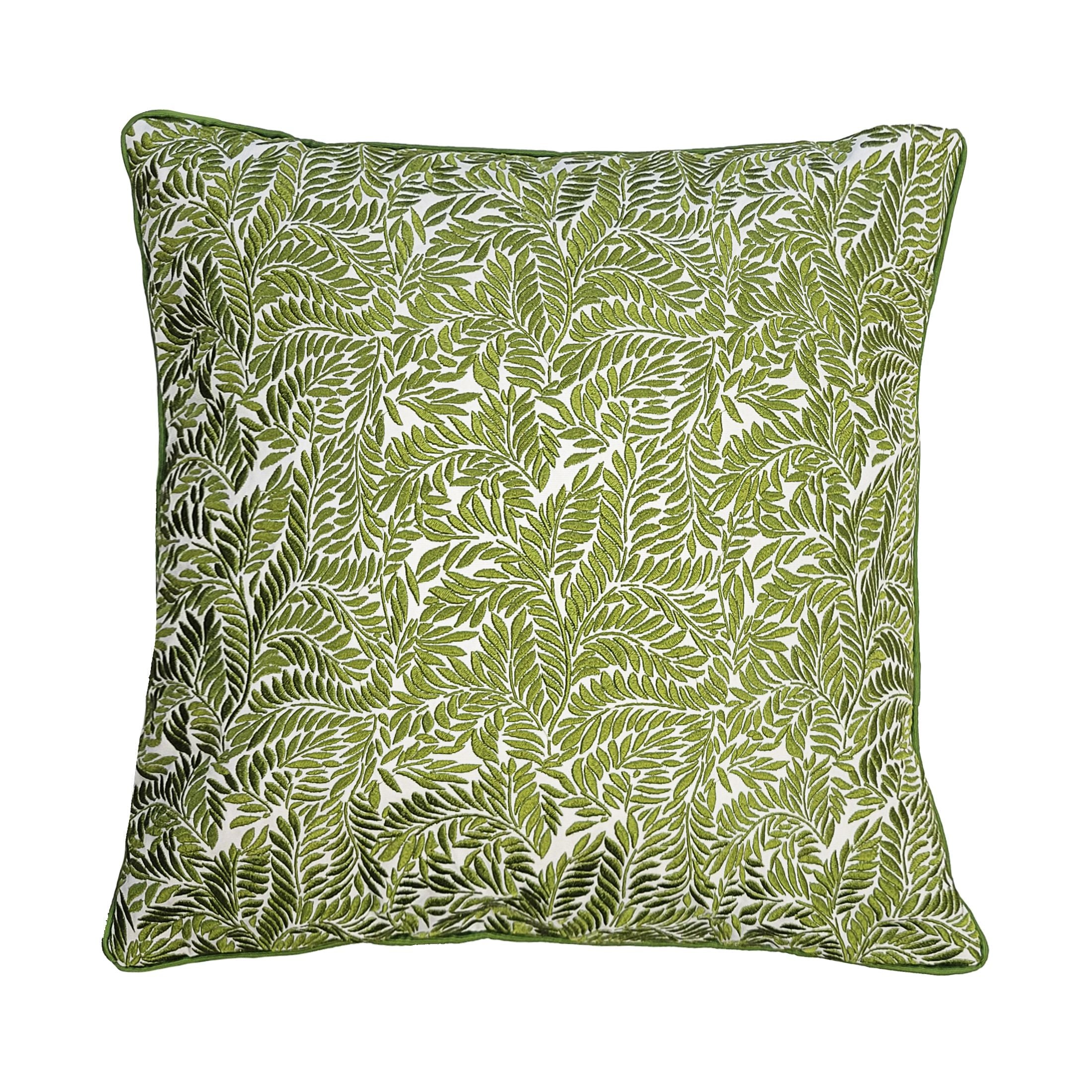 Green leaf patterned pillow on a white background