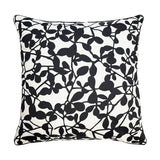 Decorative pillow with black leaf pattern on a white background