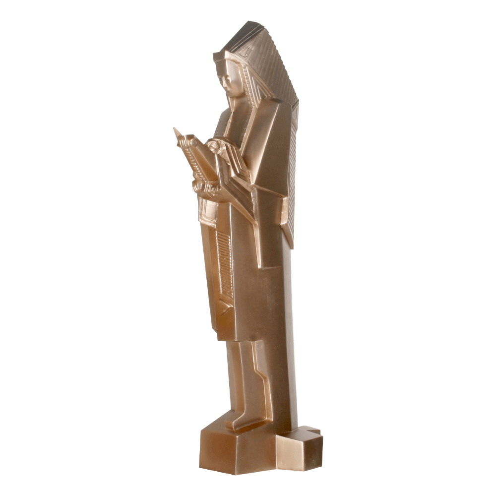 A sculpture of a figure reading, primarily in gold color, with a strong angular and vertical design, made of cold cast resin.