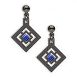 A pair of drop earrings with a geometric window design featuring a central blue square bead, made of solid brass with a hematite finish, and glass beads.